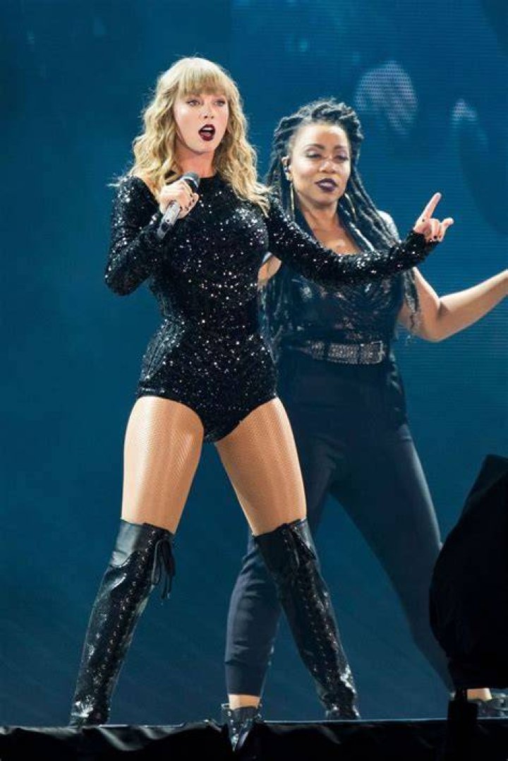 Taylor Swift is a statuesque beauty in glittering bodysuit and thigh-high boots